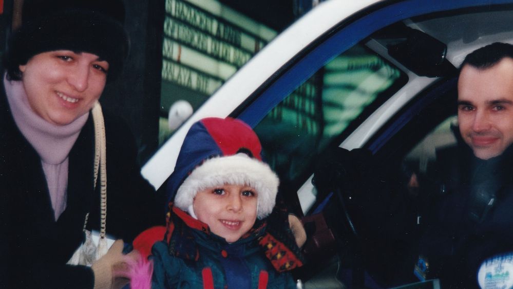 My mom and I with a police officer from the SPVM (Service de Police de la Ville de Montréal).