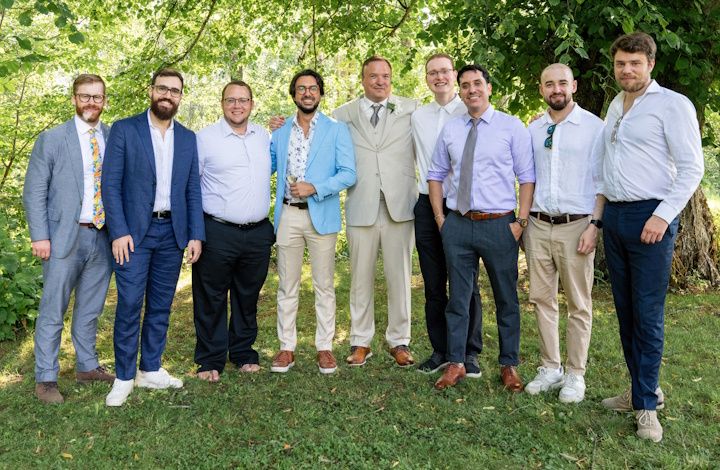 Mike and people from his team during the wedding.